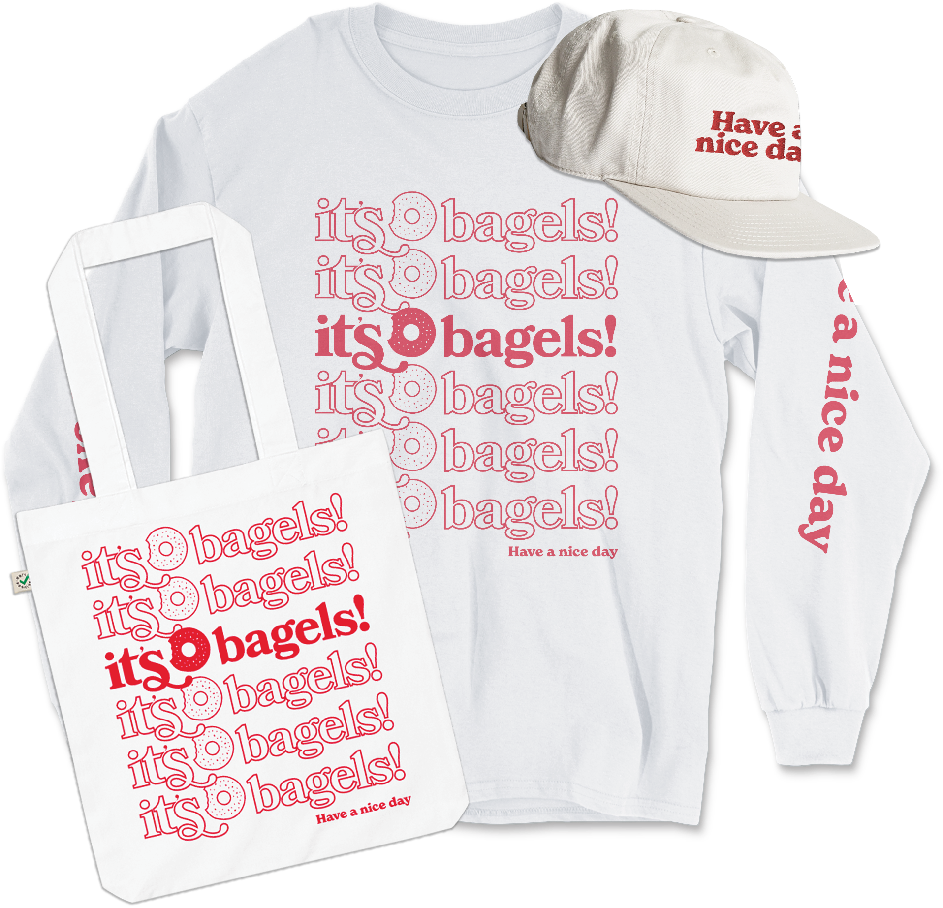 A white tote bag, long sleeve shirt, and hat, branded with the It's Bagels logo and Have a nice day in red.